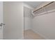 Walk-in closet with wood shelving and tile floor at 2720 High Echelon Rd, North Las Vegas, NV 89086