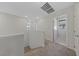 Upstairs hallway with carpeted flooring and doors to bedrooms at 2720 High Echelon Rd, North Las Vegas, NV 89086