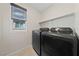 Laundry room with washer, dryer, and shelving at 2720 High Echelon Rd, North Las Vegas, NV 89086