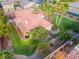 Aerial view showcasing home's backyard oasis, featuring a covered patio and lush lawn at 274 Doobie Ave, Las Vegas, NV 89183