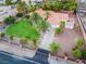 Single story home with a large grassy yard and palm trees at 274 Doobie Ave, Las Vegas, NV 89183