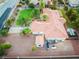 An aerial view of a house with a large backyard, shed, and surrounding landscape at 274 Doobie Ave, Las Vegas, NV 89183