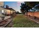 Large backyard featuring a grassy area and a pergola-covered patio at 274 Doobie Ave, Las Vegas, NV 89183