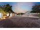 Landscaped backyard with gravel and a shed at dusk at 274 Doobie Ave, Las Vegas, NV 89183