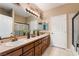 Double vanity bathroom with a large mirror at 274 Doobie Ave, Las Vegas, NV 89183