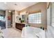 Bathroom with soaking tub, double vanity, and separate shower at 274 Doobie Ave, Las Vegas, NV 89183