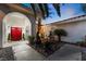 Courtyard with red doors, fire pit, fountain, and stone pathway at 274 Doobie Ave, Las Vegas, NV 89183