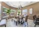 Bright dining area with seating for six and a farmhouse table at 274 Doobie Ave, Las Vegas, NV 89183