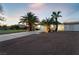 House exterior with palm trees and driveway at dusk at 274 Doobie Ave, Las Vegas, NV 89183