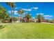 Spacious green lawn in front of a single-story house and palm trees at 274 Doobie Ave, Las Vegas, NV 89183