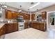 Spacious kitchen with wood cabinets and island at 274 Doobie Ave, Las Vegas, NV 89183