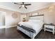 Main bedroom with a king-size bed and dark wood floors at 274 Doobie Ave, Las Vegas, NV 89183