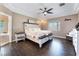 Main bedroom with a king-size bed and dark wood floors at 274 Doobie Ave, Las Vegas, NV 89183