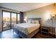 Main bedroom with a king-size bed and balcony access at 29 Montelago Blvd # 317, Henderson, NV 89011