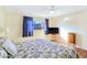 Main bedroom with king-size bed, TV, and plenty of natural light at 3169 Nottingham Dr, Las Vegas, NV 89121