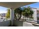 Private balcony overlooking community trees and buildings at 3318 N Decatur Blvd # 2138, Las Vegas, NV 89130