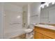 Updated bathroom with tub, shower, and wood vanity at 3318 N Decatur Blvd # 2138, Las Vegas, NV 89130