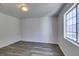 Spacious bedroom with wood-look floors and window at 3318 N Decatur Blvd # 2138, Las Vegas, NV 89130