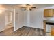 View of dining area with laminate flooring and access to the kitchen and bathroom at 3318 N Decatur Blvd # 2138, Las Vegas, NV 89130