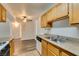 Kitchen with double sink and wood cabinets at 3318 N Decatur Blvd # 2138, Las Vegas, NV 89130