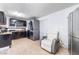 Kitchen features dark cabinetry, stainless steel appliances, and tile flooring at 35 Jade Cir, Las Vegas, NV 89106