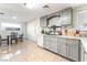 Modern kitchen with gray cabinets, updated appliances, and tile floors at 35 Jade Cir, Las Vegas, NV 89106