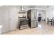 Stainless steel appliances and gray cabinetry in a modern kitchen at 35 Jade Cir, Las Vegas, NV 89106