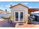 White storage shed with double doors in backyard at 35 Jade Cir, Las Vegas, NV 89106