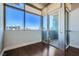 Bright living room with hardwood floors and access to balcony at 353 E Bonneville Ave # 804, Las Vegas, NV 89101