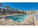 Resort-style pool with lounge chairs and palm trees at 353 E Bonneville Ave # 804, Las Vegas, NV 89101