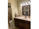 Clean bathroom with dark wood vanity, large mirror and shower/tub combo at 3550 Bay Sands Dr # 2062, Laughlin, NV 89029