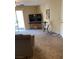 Spacious living room with a large TV and access to a patio at 3550 Bay Sands Dr # 2062, Laughlin, NV 89029