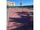 Outdoor shuffleboard and tennis courts behind a fence with palm tree and building in the background at 3550 Bay Sands Dr # 2062, Laughlin, NV 89029