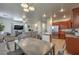 Kitchen and dining area with wood cabinets and a gray table at 3592 Gloucester Gate St, Las Vegas, NV 89122