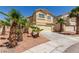 Two-story house with attached garage and palm trees at 3728 Shallow Dove Ct, North Las Vegas, NV 89032