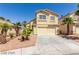 Two-story house with attached garage and desert landscaping at 3728 Shallow Dove Ct, North Las Vegas, NV 89032