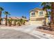 Two-story house with attached garage and palm trees at 3728 Shallow Dove Ct, North Las Vegas, NV 89032