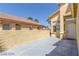 Front entrance with gray concrete patio and white door at 3728 Shallow Dove Ct, North Las Vegas, NV 89032