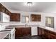 Kitchen features dark wood cabinets and modern appliances at 3728 Shallow Dove Ct, North Las Vegas, NV 89032