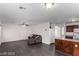 Bright living room with dark gray floors and a comfy couch at 3728 Shallow Dove Ct, North Las Vegas, NV 89032