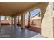 Covered patio area with arched columns and desert landscaping at 3728 Shallow Dove Ct, North Las Vegas, NV 89032