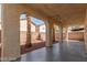 Spacious covered patio with arched entryways and desert landscaping at 3728 Shallow Dove Ct, North Las Vegas, NV 89032