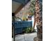 Small patio with palm trees and privacy fence at 4031 Gold Coast Dr, Las Vegas, NV 89121