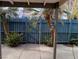 Cozy backyard with gate and palm trees at 4031 Gold Coast Dr, Las Vegas, NV 89121