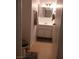 Clean bathroom with vanity, mirror, and wood floor at 4031 Gold Coast Dr, Las Vegas, NV 89121