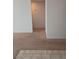 Clean hallway with neutral carpet and tile flooring at 4031 Gold Coast Dr, Las Vegas, NV 89121