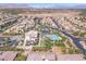 Aerial view of community with pool, tennis courts, and numerous homes at 4308 Sunrise Flats St, Las Vegas, NV 89135