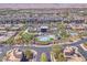 Aerial view of community, showing homes, pool, and surrounding area at 4308 Sunrise Flats St, Las Vegas, NV 89135