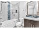 Clean bathroom with tub, toilet and modern vanity at 4308 Sunrise Flats St, Las Vegas, NV 89135