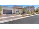 Stunning modern home with stone accents and landscaped front yard at 4308 Sunrise Flats St, Las Vegas, NV 89135